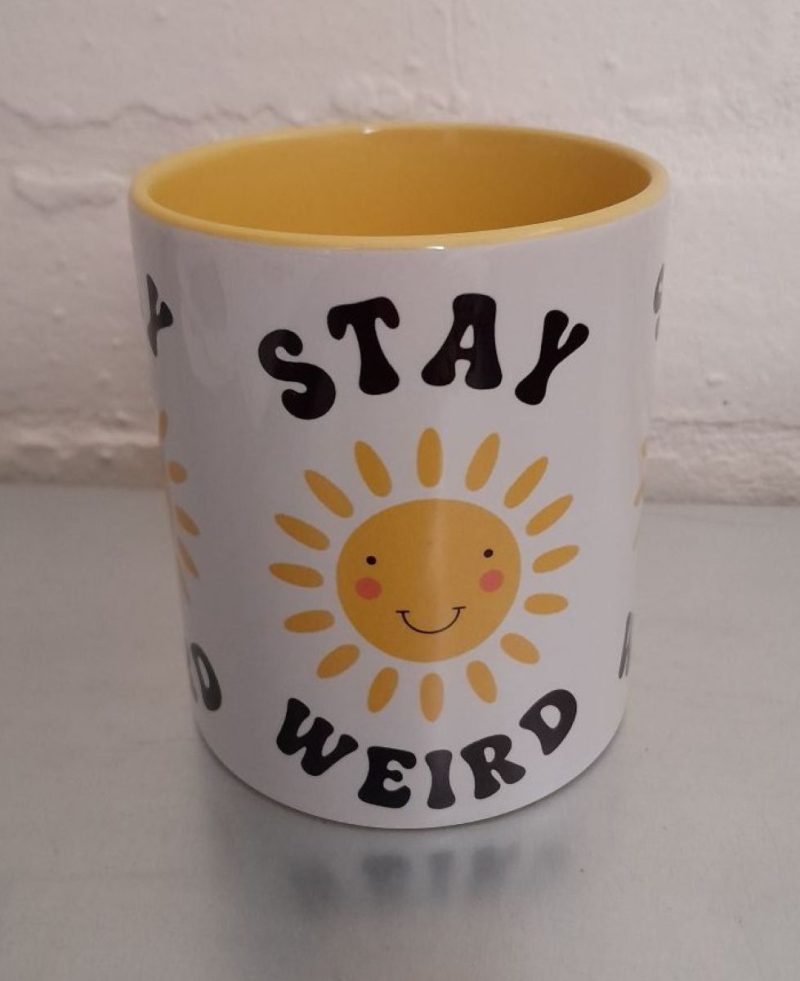 Stay Weird mug with smiling sun - brighten your day!