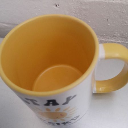 Stay Weird mug with smiling sun - brighten your day!