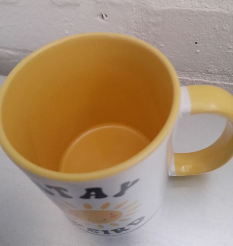 Stay Weird mug with smiling sun - brighten your day!