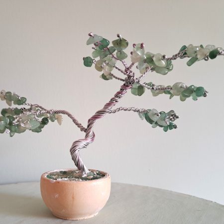 Semi precious green adventurine stone tree sculpture. Stands in a pot decorated with stones.