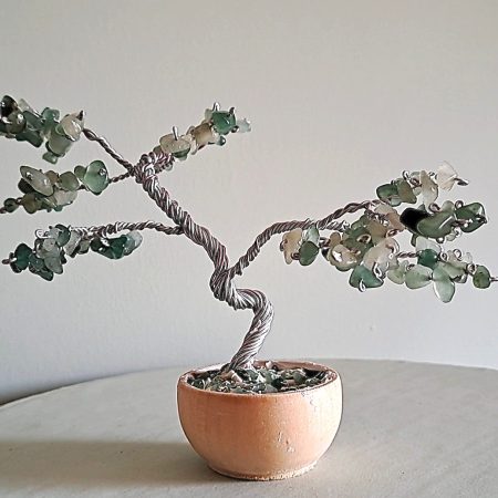 Semi precious green adventurine stone tree sculpture. Stands in a pot decorated with stones.