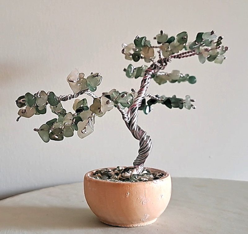 Semi precious green adventurine stone tree sculpture. Stands in a pot decorated with stones.