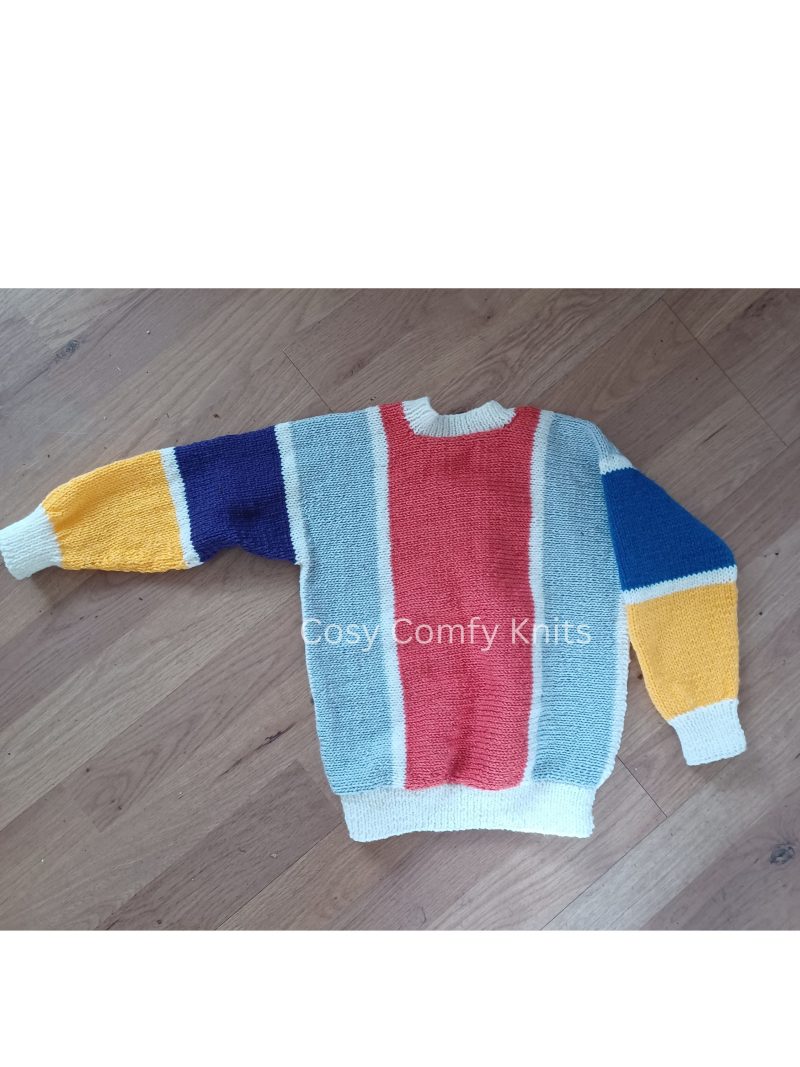 Handknitted Jumper, knitted from side to side. Soft and colourful. Fun and colourful. Made with easy care acrylic yarn.