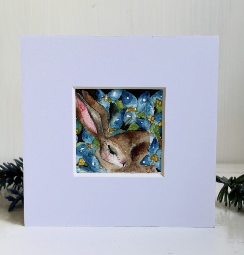 Mounted Original ACEO Resting hare rabbit with blue flowers watercolour