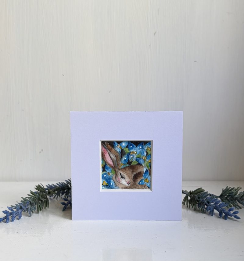 Mounted Original ACEO Resting hare rabbit with blue flowers watercolour