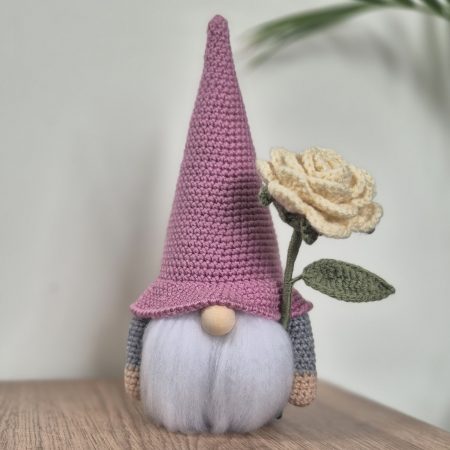 Crochet Gonk with flower.