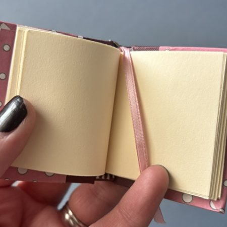 Handmade Notebook Keyring | 48 pages | Burgundy book cloth spine with pink cover with white dots | Unlined paper