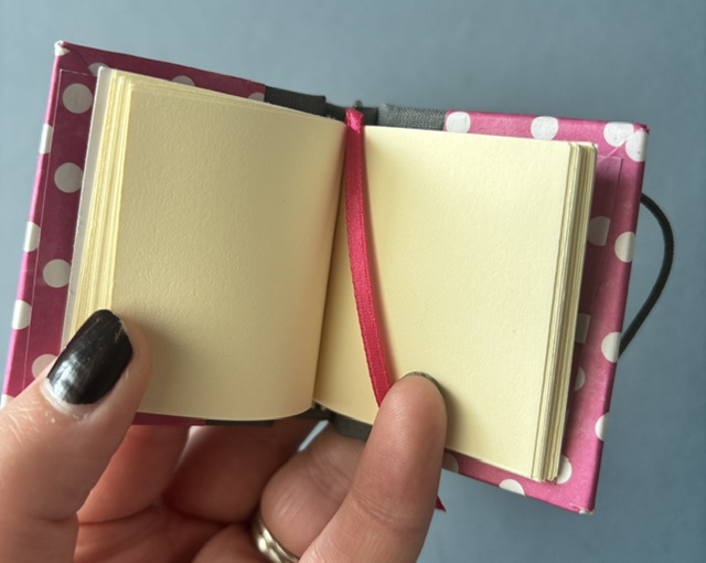 Handmade Notebook Keyring | 48 pages | Grey spine with pink cover and white polka dots | Ribbon page marker