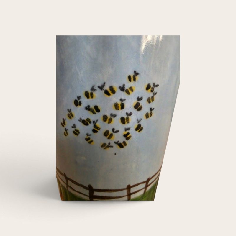 Hand painted ceramic watering can.