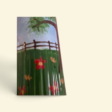 Hand painted ceramic watering can.