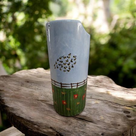 Hand painted ceramic watering can.