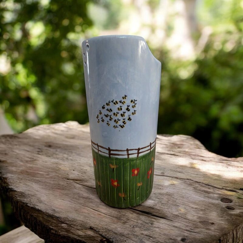 Hand painted ceramic watering can.