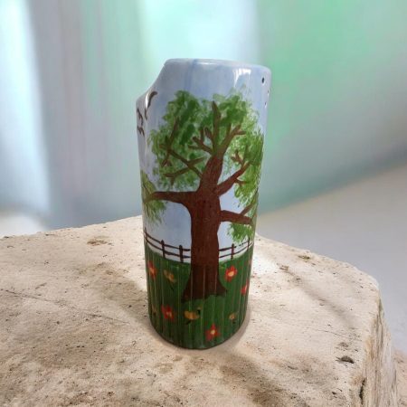 Hand painted ceramic watering can.