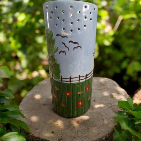 Hand painted ceramic watering can.