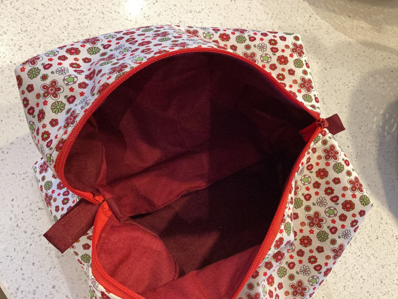 Pretty Red/White/Green Floral Fabric, Red Zipped, Toiletry/Cosmetic/Make Up Bag with two tone Burgundy Lining