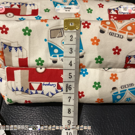 Small/Medium White Multicoloured Campervan Print Fabric Zipped Lined Make Up Bag/Pouch Why not brighten up your holiday essentials with this gorgeous White Multicoloured Campervan Print Fabric Zipped Lined Make Up Bag/Pouch.