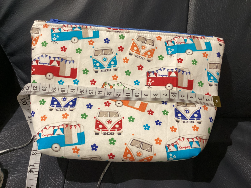 Small/Medium White Multicoloured Campervan Print Fabric Zipped Lined Make Up Bag/Pouch Why not brighten up your holiday essentials with this gorgeous White Multicoloured Campervan Print Fabric Zipped Lined Make Up Bag/Pouch.