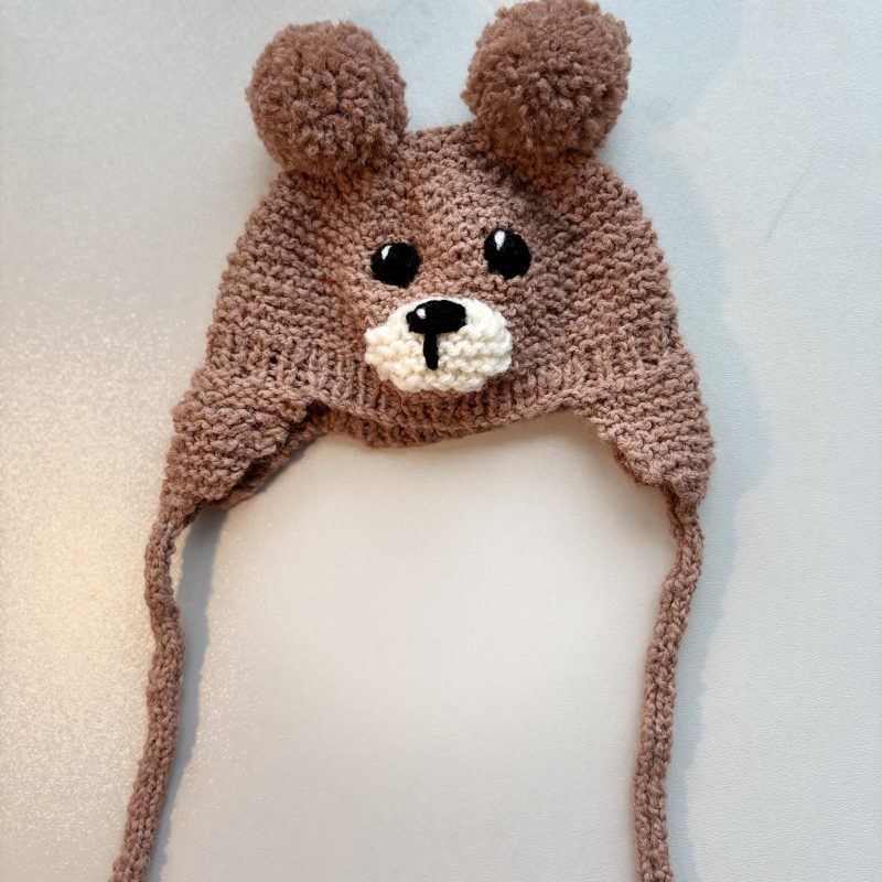 Hand knitted beige baby bear, trapper style hat with chin ties. Available in 3 sizes