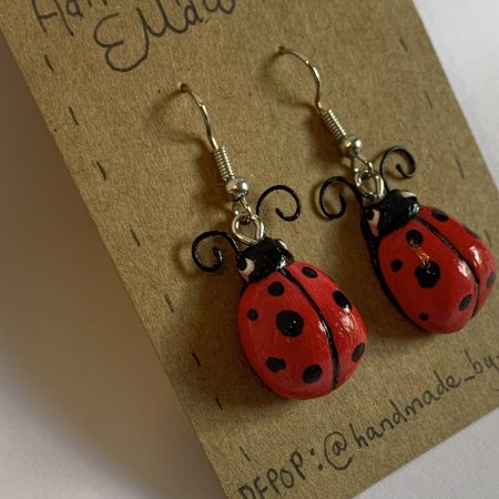 Hand-sculpted and painted red spotted ladybird earrings with stainless steel hooks