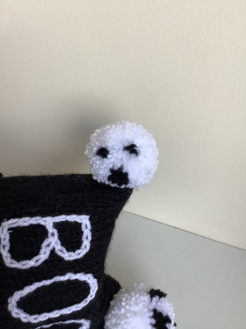 Black & white hand knitted spooky baby hat sizes from 0-18 months