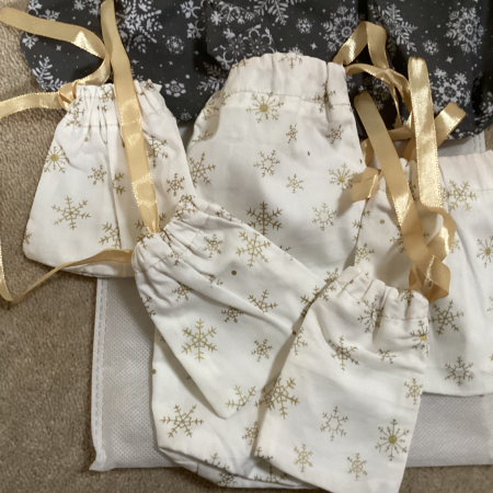 Handmade Selection of 7 Fabric gift bags 2 x Grey with White Snowflakes 5 x Small Gorgeous Gold Star Patterned Fabric