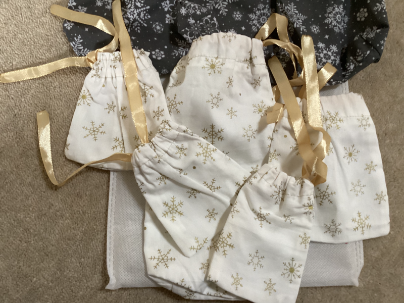 Handmade Selection of 7 Fabric gift bags 2 x Grey with White Snowflakes 5 x Small Gorgeous Gold Star Patterned Fabric