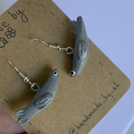 Hand-sculpted and painted clay seal earrings with silver tone stainless steel hooks