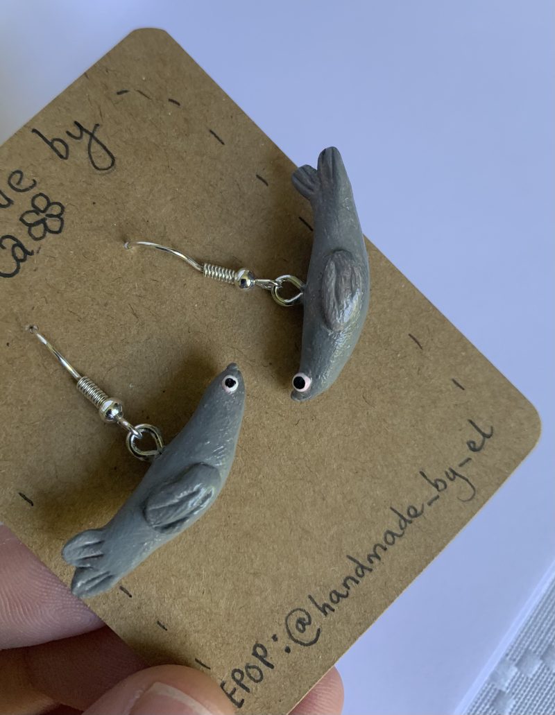 Hand-sculpted and painted clay seal earrings with silver tone stainless steel hooks