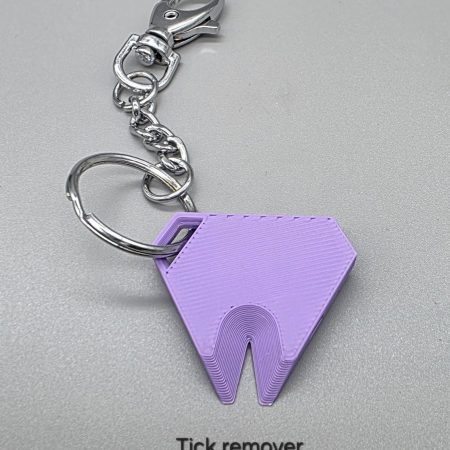 Tick remover tool/whistle with keychain