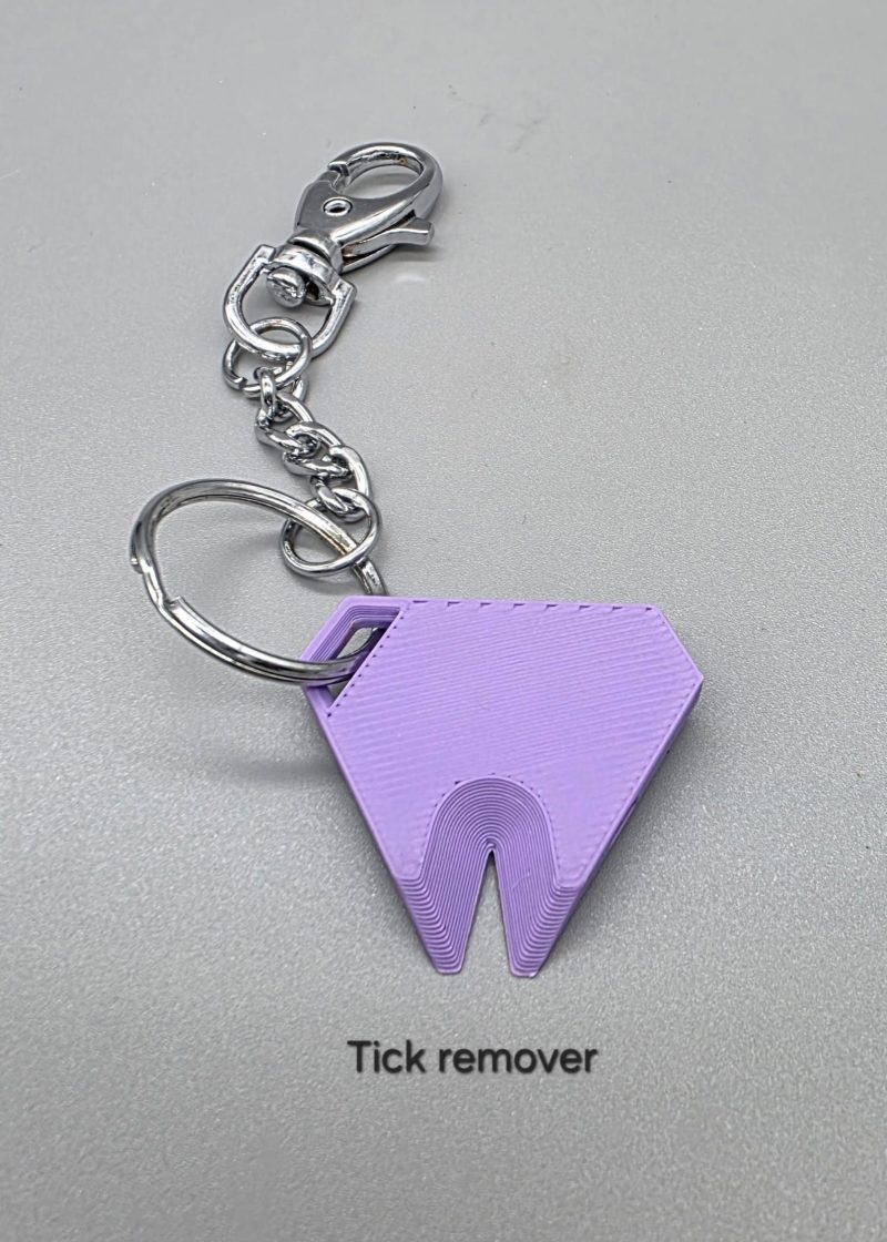 Tick remover tool/whistle with keychain
