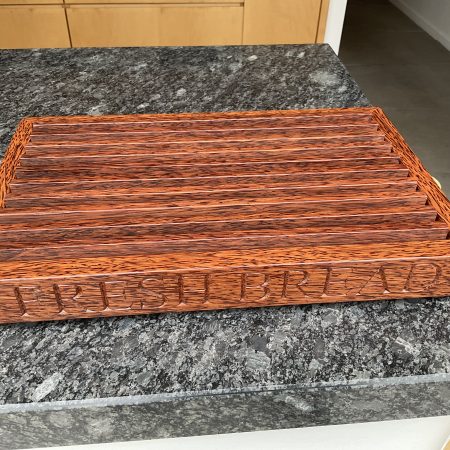 A premier coconut and oak crumb catcher bread board