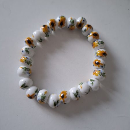 White ceramic beaded bracelet with sunflower print