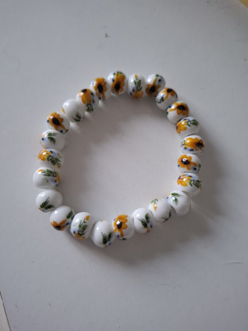 White ceramic beaded bracelet with sunflower print