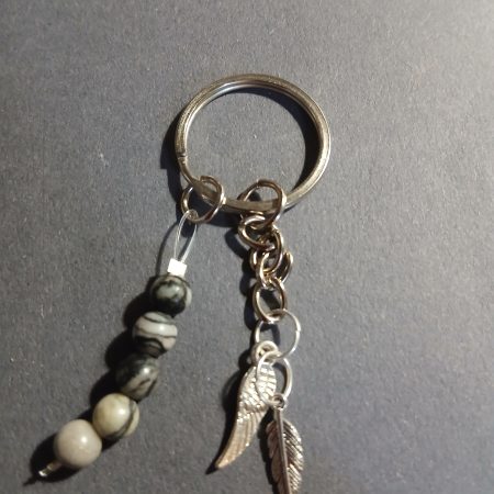 Beaded keyring with wings and with natural crystals.