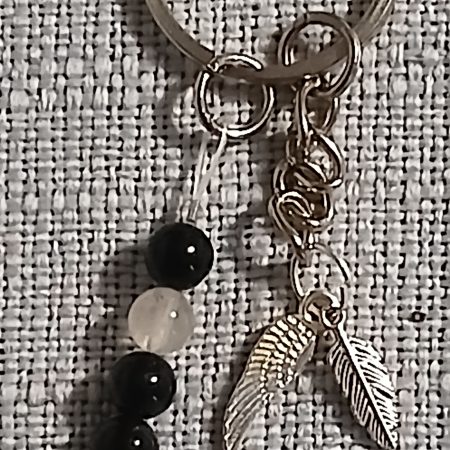 Beaded keyring with wings and with natural crystals.