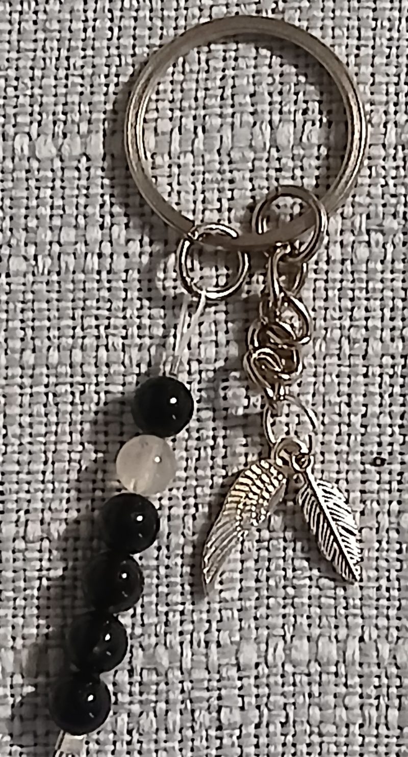 Beaded keyring with wings and with natural crystals.