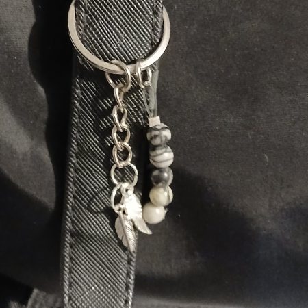 Beaded keyring with wings and with natural crystals.