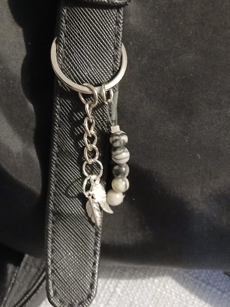 Beaded keyring with wings and with natural crystals.