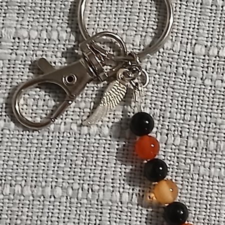 Beaded keyring with wings and with natural crystals.
