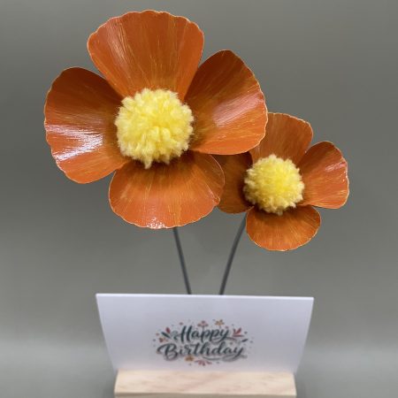 Hand crafted orange and yellow metal flowers with birthday card and stand