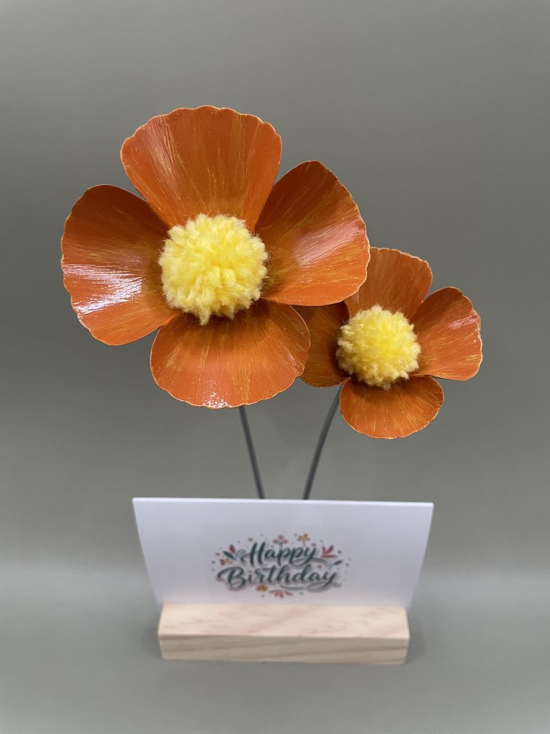 Hand crafted orange and yellow metal flowers with birthday card and stand