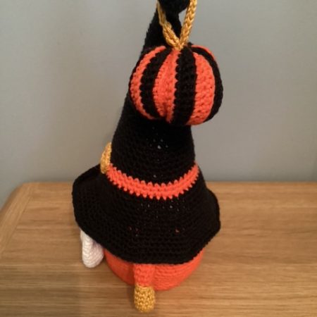 Hand made crocheted Halloween Gnome, main colours orange ,black, white and gold. 30cm tall.