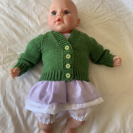 Green cardigan for a reborn doll or baby doll