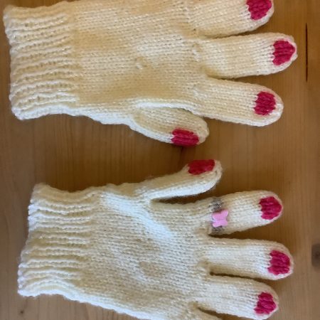 Hand-knitted cream sparkle gloves for children