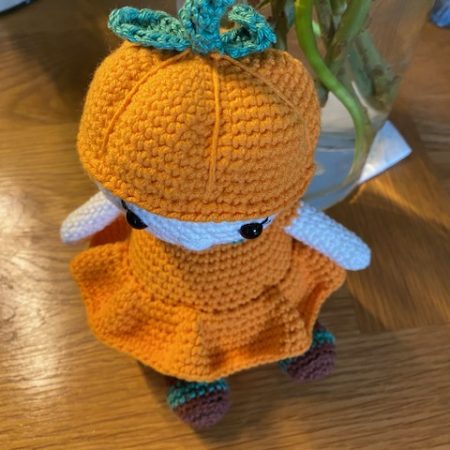 Poppy the Pumpkin Doll wearing her Halloween party dress