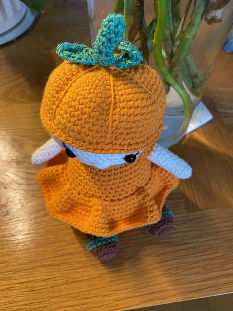 Poppy the Pumpkin Doll wearing her Halloween party dress