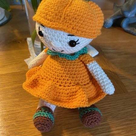 Poppy the Pumpkin Doll wearing her Halloween party dress