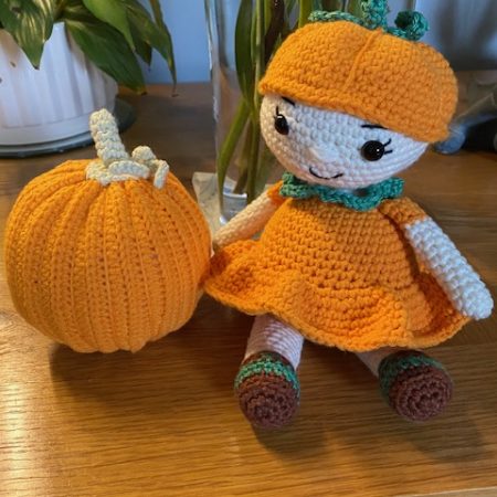 Poppy the Pumpkin Doll wearing her Halloween party dress