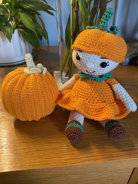 Poppy the Pumpkin Doll wearing her Halloween party dress