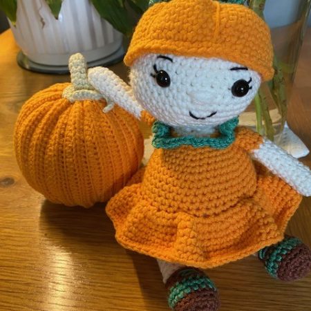 Poppy the Pumpkin Doll wearing her Halloween party dress